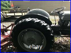 Massey Ferguson tractor with Finishing Mower, Box Blade, and Bucket attachments
